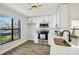 Stylish kitchen with white cabinetry, stainless steel appliances, and a bright modern lighting fixture at 413 Mainsail Ct, Lake Mary, FL 32746