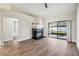 Bright living room featuring a fireplace and sliding doors to the outdoor patio with lots of natural light at 413 Mainsail Ct, Lake Mary, FL 32746