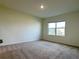 Spacious bedroom with plush carpet and natural light streaming through the windows at 5384 Palomino Pl, Apopka, FL 32712