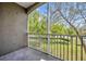 Screened balcony with views of trees and green space, providing a relaxing outdoor area at 581 Brantley Terrace Way # 209, Altamonte Springs, FL 32714