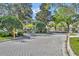 Paved driveway and an entrance to the community featuring nice landscaping at 581 Brantley Terrace Way # 209, Altamonte Springs, FL 32714