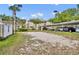 Sand volleyball court in a community with a building, covered parking, and blue skies in the background at 581 Brantley Terrace Way # 209, Altamonte Springs, FL 32714