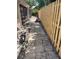 A stone backyard with a privacy fence, exterior wall, and pool at 6037 Hickory Grove Ln, Port Orange, FL 32128