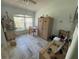 Bedroom with window, neutral paint, and neutral tile flooring at 6037 Hickory Grove Ln, Port Orange, FL 32128