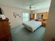 Bedroom with a bed, built-in storage, and a view of the window at 6037 Hickory Grove Ln, Port Orange, FL 32128