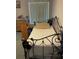 Bedroom featuring an ornate iron daybed, dresser, and a window with bright natural light at 6037 Hickory Grove Ln, Port Orange, FL 32128