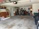 Spacious two car garage with overhead lighting and storage area at 6037 Hickory Grove Ln, Port Orange, FL 32128