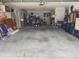 Two car garage featuring concrete flooring and a back storage area at 6037 Hickory Grove Ln, Port Orange, FL 32128