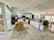 Bright, open-concept kitchen boasting sleek countertops and tile floors at 6037 Hickory Grove Ln, Port Orange, FL 32128
