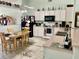 Well-equipped kitchen with white appliances, plentiful storage, and adjacent dining space at 6037 Hickory Grove Ln, Port Orange, FL 32128