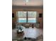 View of the backyard pool from the living room featuring nautical decor at 6037 Hickory Grove Ln, Port Orange, FL 32128
