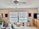 View of the backyard pool from the living room featuring built in cabinets at 6037 Hickory Grove Ln, Port Orange, FL 32128