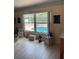 Living room showcasing a window with a view of the pool area at 6037 Hickory Grove Ln, Port Orange, FL 32128