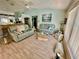 Cozy living room featuring neutral tones, wood floors, and natural light at 6037 Hickory Grove Ln, Port Orange, FL 32128