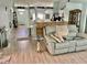 Open-concept living area with bar, seating and a view of the front door and kitchen at 6037 Hickory Grove Ln, Port Orange, FL 32128