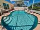 Sparkling screened pool with sun-drenched patio area for outdoor enjoyment and relaxation at 6037 Hickory Grove Ln, Port Orange, FL 32128