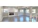 Bright, open living room featuring modern gray flooring and fireplace at 604 Missouri Ave, St Cloud, FL 34769