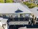 Aerial shot of condo building exterior showing garage parking and covered outdoor living spaces at 604 Mulberry Ave # 1201, Kissimmee, FL 34747