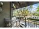 Charming balcony featuring metal railings and a table and chairs, perfect for enjoying the outdoors at 604 Mulberry Ave # 1201, Kissimmee, FL 34747