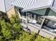 Aerial view of a well-maintained home with a metal roof and trees in the foreground at 604 Mulberry Ave # 1201, Kissimmee, FL 34747