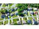 Bird's eye view of neighborhood homes with green yards and tree lined streets at 608 Robin Ln, Kissimmee, FL 34759