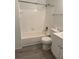 Clean bathroom featuring white fixtures and a shower/tub combo at 6142 Westgate Dr # 304, Orlando, FL 32835