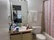 Functional bathroom features a sink, toilet, and shower/tub combination at 6142 Westgate Dr # 304, Orlando, FL 32835