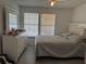 Bright bedroom with a neutral color scheme, including a large dresser and comfortable bed at 6142 Westgate Dr # 304, Orlando, FL 32835