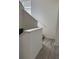 Hallway with neutral color palette, stairs and oak floors at 6142 Westgate Dr # 304, Orlando, FL 32835