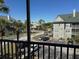 View from screened patio of lush landscaping and community parking at 6142 Westgate Dr # 304, Orlando, FL 32835