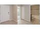 Foyer showcasing tile flooring, neutral paint, a white door and a view to the bathroom and bedroom at 6611 Lullaby Ln, Mascotte, FL 34753