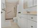 Bright bathroom with a walk-in shower and neutral toned vanity at 700 Melrose Ave # L-23, Winter Park, FL 32789