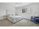 Serene bedroom with soft carpet, comfortable queen bed, and a large window with light-filtering shutters at 700 Melrose Ave # L-23, Winter Park, FL 32789