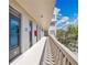 Exterior hallway to unit features solid doors, fresh paint, and a well-lit corridor at 700 Melrose Ave # L-23, Winter Park, FL 32789