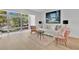 Bright, open living area with a large window and hardwood floors, creating an inviting and airy space at 700 Melrose Ave # L-23, Winter Park, FL 32789