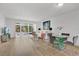 Bright living room featuring large windows, hardwood floors, and an open floor plan perfect for entertaining at 700 Melrose Ave # L-23, Winter Park, FL 32789