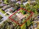 Aerial view of a luxurious home nestled among trees, highlighting the property's generous lot size and privacy at 8713 Shimmering Pine Pl, Sanford, FL 32771