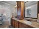 Spacious bathroom features a double vanity with granite countertops and a view into the shower at 8713 Shimmering Pine Pl, Sanford, FL 32771