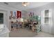 bedroom with a bunk bed, shelving and adjacent bedroom access, plus light from a large window at 8713 Shimmering Pine Pl, Sanford, FL 32771