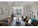 Elegant living room boasting natural light, stylish furniture, and a seamless flow into other rooms at 8713 Shimmering Pine Pl, Sanford, FL 32771