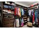 Organized walk-in closet with shelving for clothes, shoes, and accessories at 8713 Shimmering Pine Pl, Sanford, FL 32771