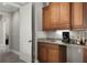 A wet bar off the bedroom, featuring under cabinet lights and a sink at 8713 Shimmering Pine Pl, Sanford, FL 32771