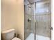 Bathroom with a glass-enclosed shower with tile surround and modern fixtures at 8845 Candy Palm Rd, Kissimmee, FL 34747