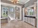 Elegant bathroom featuring dual vanities, a soaking tub, and a luxurious glass shower at 9372 Thurloe Pl, Orlando, FL 32827