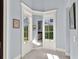 Charming hallway featuring natural light and decorative trim at 9372 Thurloe Pl, Orlando, FL 32827