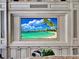 Close up of media center with a decorative fireplace at 9372 Thurloe Pl, Orlando, FL 32827