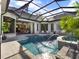 A sparkling pool and spa offer a refreshing escape, surrounded by lush landscaping and elegant architecture at 9372 Thurloe Pl, Orlando, FL 32827