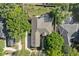 Bird's eye view of the home with a screened in-ground pool at 9548 Crown Prince Ln, Windermere, FL 34786