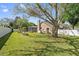 Grassy backyard featuring a screened in-ground pool, perfect for relaxation at 9548 Crown Prince Ln, Windermere, FL 34786