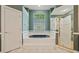 Bathroom with a large tub and a separate shower stall at 9548 Crown Prince Ln, Windermere, FL 34786